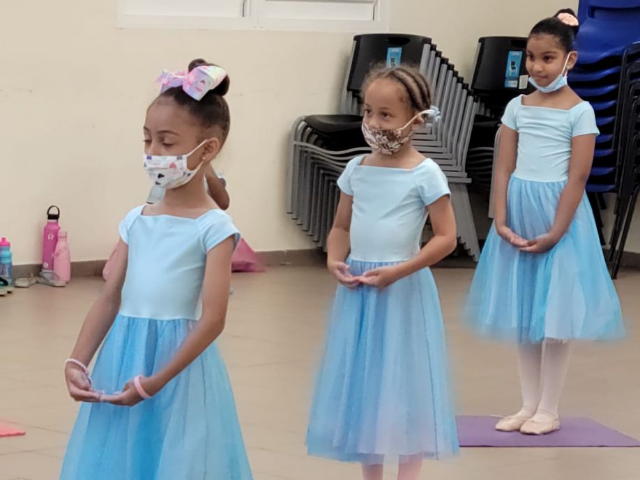 Young dancers taking part in the Princess Program in blue ballet dresses