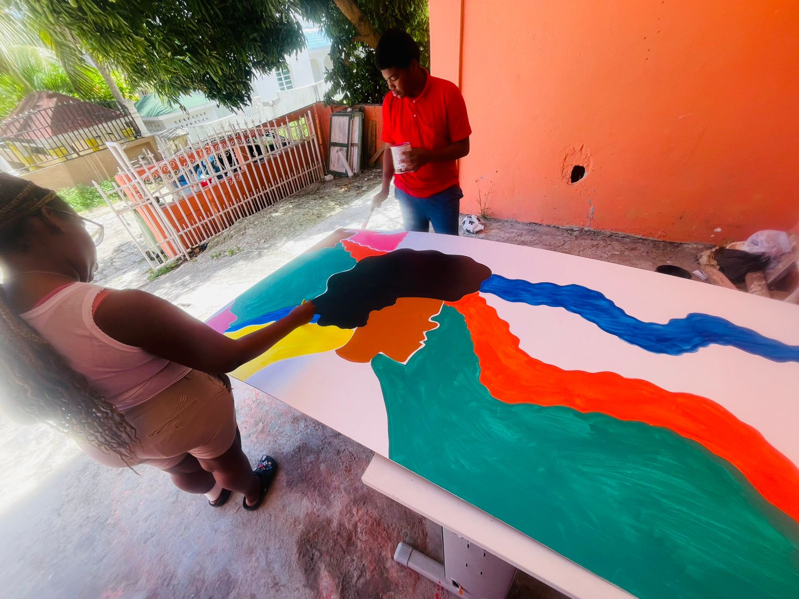 Foster youth working together during the Art Saves Lives mural workshop
