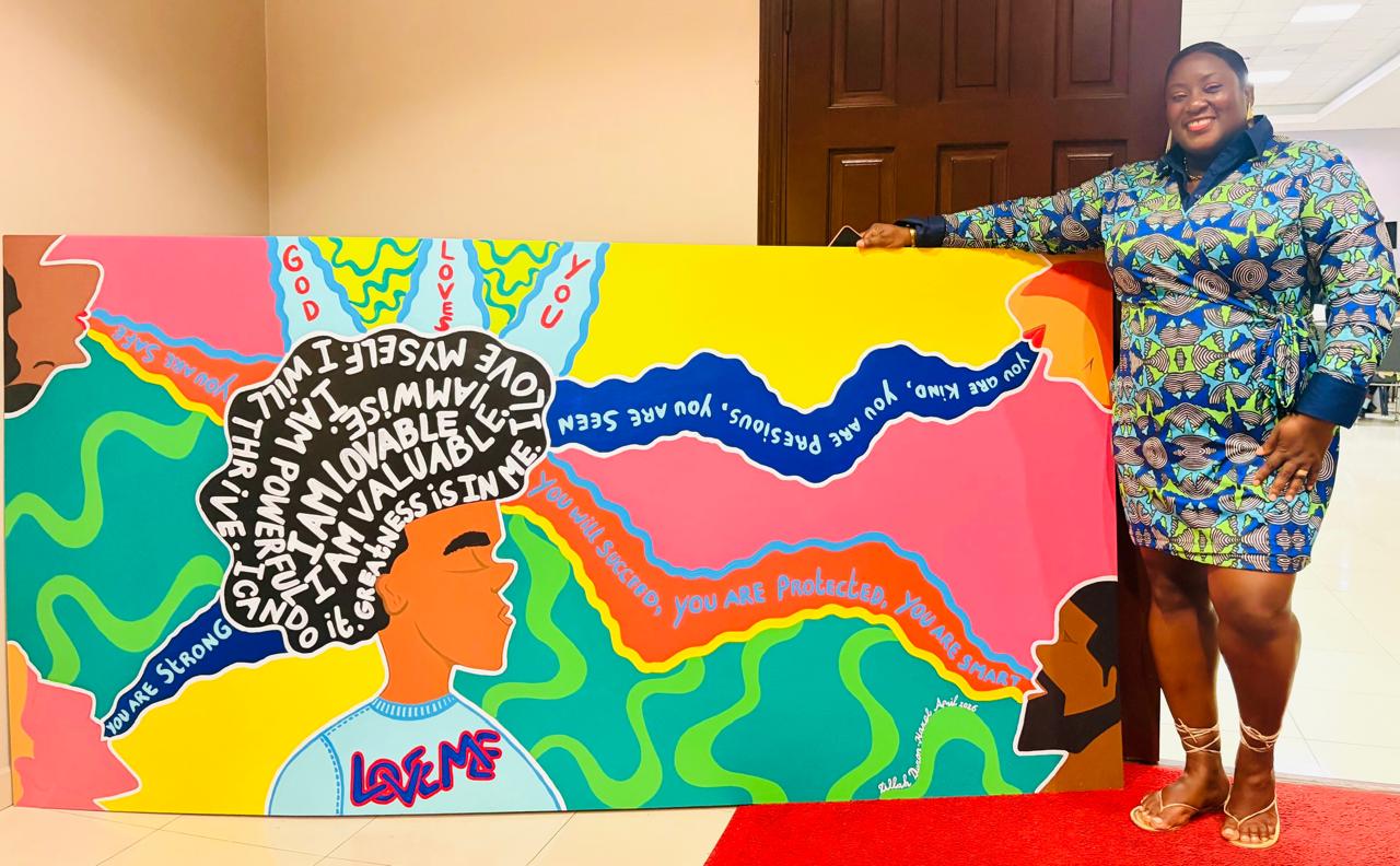 A RISE Foundation representative with the mural won through the silent auction